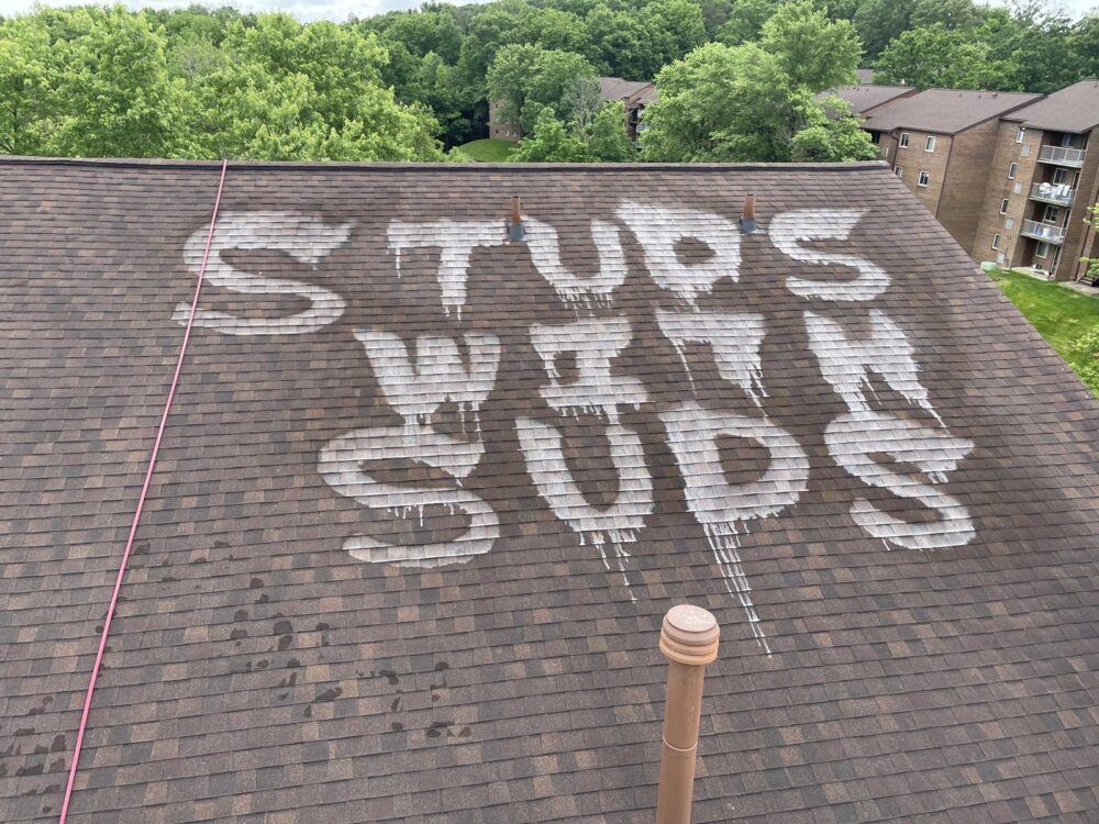 Studs With Suds name cleaned into an apartment roof in Laurel, Maryland