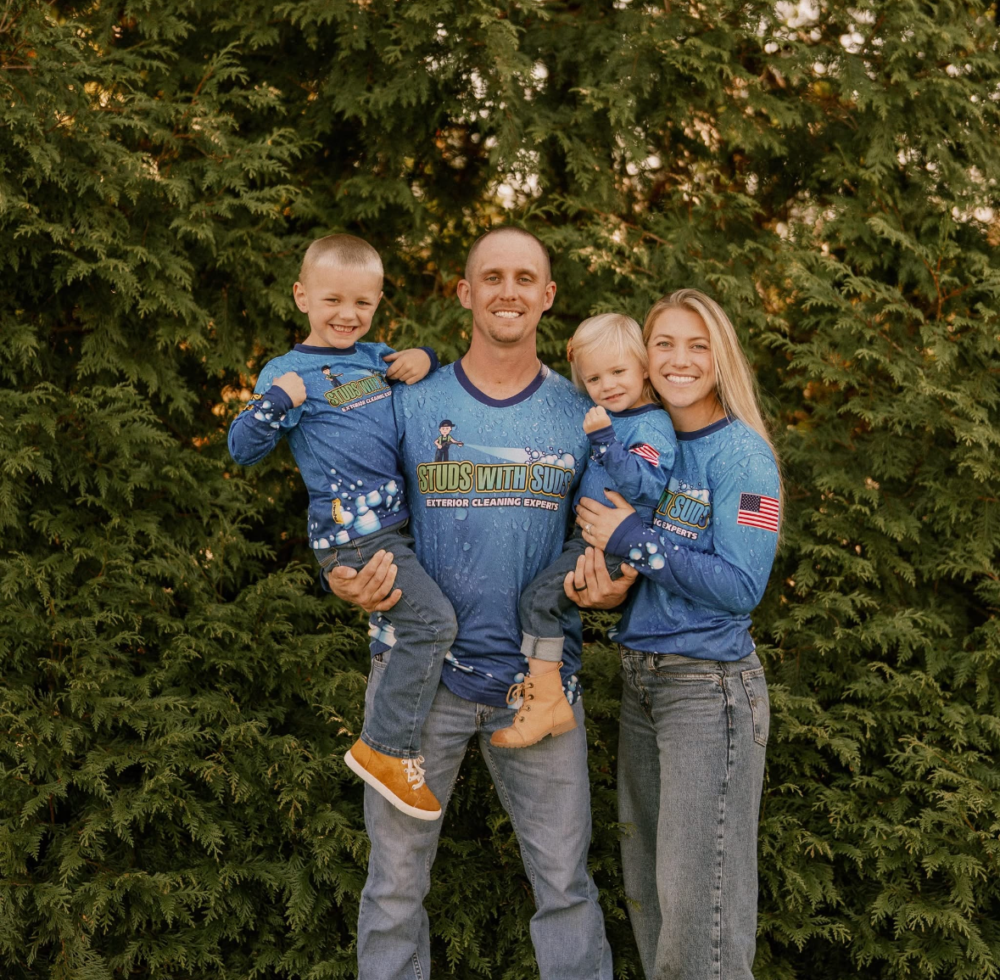 Brandon and his family wearing Studs With Suds shirts outdoors