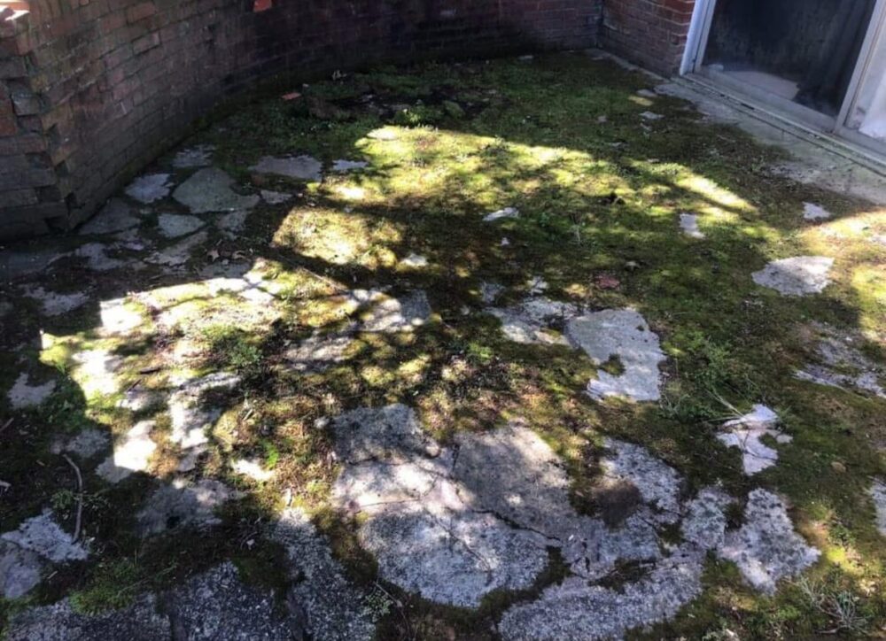 Stone patio in Columbia, Maryland before cleaning